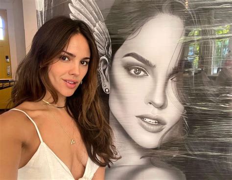 Eiza González poses naked but covered in body art